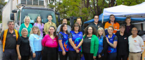 New Life Foodbarn volunteers and community representatives gathered outside the Arundel Foodbarn